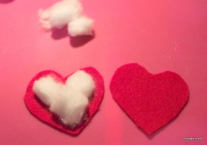 To make the hearts puffy I used cotton balls.  I also put them together the lazy/easy way: I hot glued them together.  Maybe next time I will get my needle and thread out.  