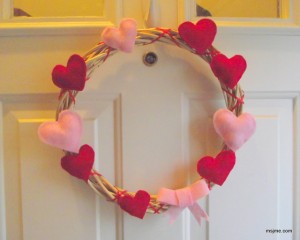 My front door has been naked since Christmas...So I put together this cute felt heart wreath. 