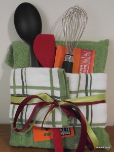This is how you wrap a cook book! I purchased a pair of kitchen towels and folded them over the book. Tucked in a couple utensils, and tied some ribbon around it. If you need a quick and cute wedding shower gift idea, do this!