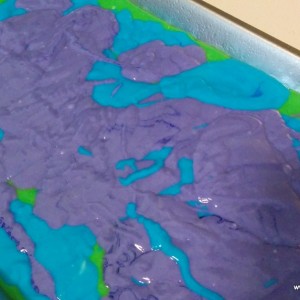The cake itself was vanilla flavored. I used my Rainbow Cake technique and made it purple, green and blue. 
