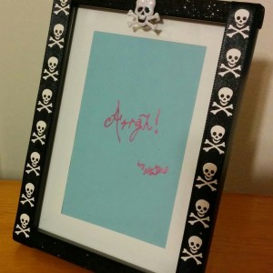 All you need is a photo frame, some ribbon, glue and bling to make this craft. Assembly is based on this post about personalized frames.